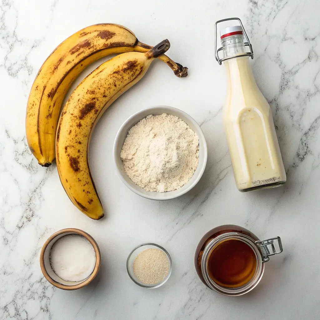 Vegane Banana Pancakes Zutaten: reife Bananen, Mehl, Pflanzenmilch, Ahornsirup & Backpulver – einfach & gesund